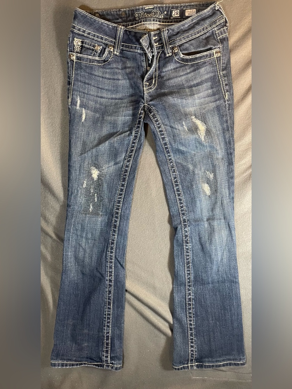 Miss Me Distressed Bootcut Jeans - Skull Pocket Lining & Leather Cross Patch